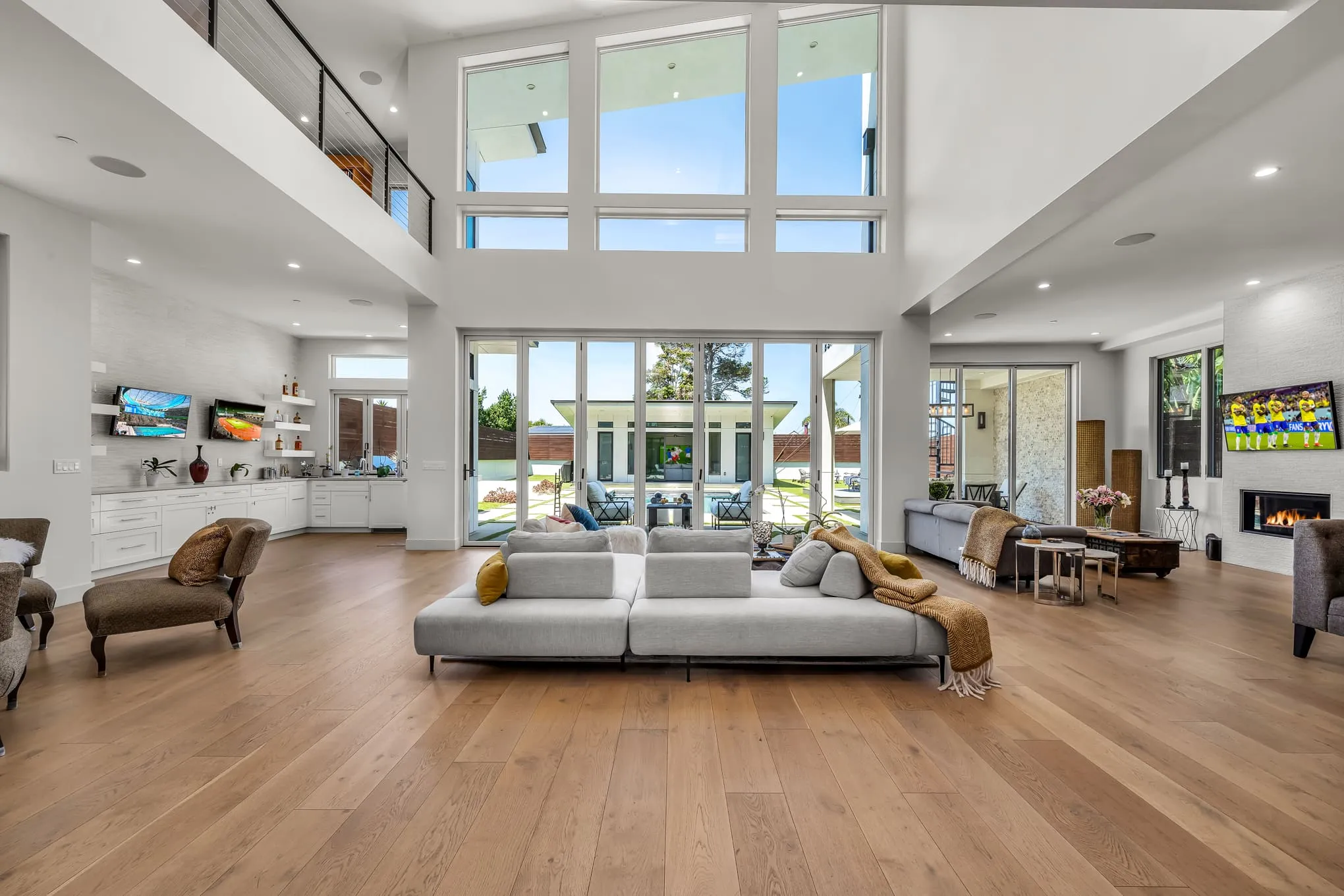 Double-height great room opening to the backyard